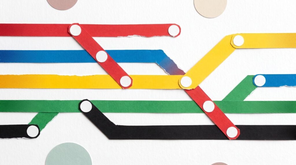 Paper collage of colored lines running like a transit map, each line starting and stopping at stations, like the sounds in a beat coming in and out section by section