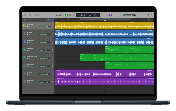 GarageBand on a MacBook with drum, guitar, keyboard and vocal tracks in the track view