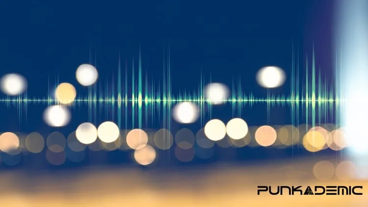 Udemy course image for Music Mastering Masterclass: a glowing waveform over blurred lights
