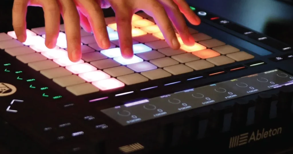Soundfly Intro to Music Production in Ableton Live image of hands playing an Ableton Push