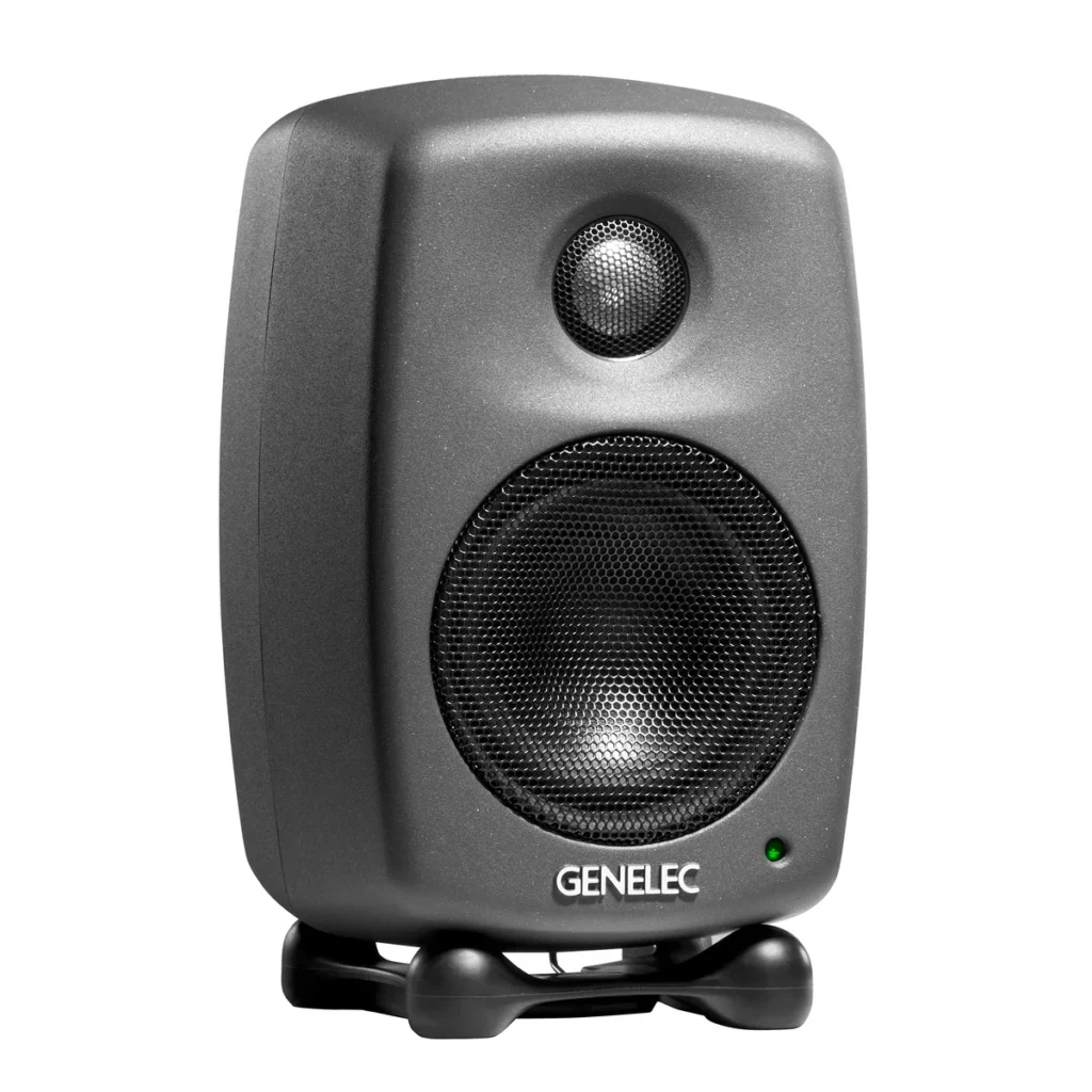 Genelec 8010A studio monitor in dark grey on its rubber Iso-Pod stand