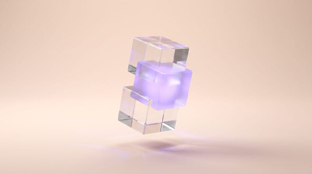 Three stacked glass cubes with the middle one glowing violet, like the root, third and fifth of a chord where the third sets the mood