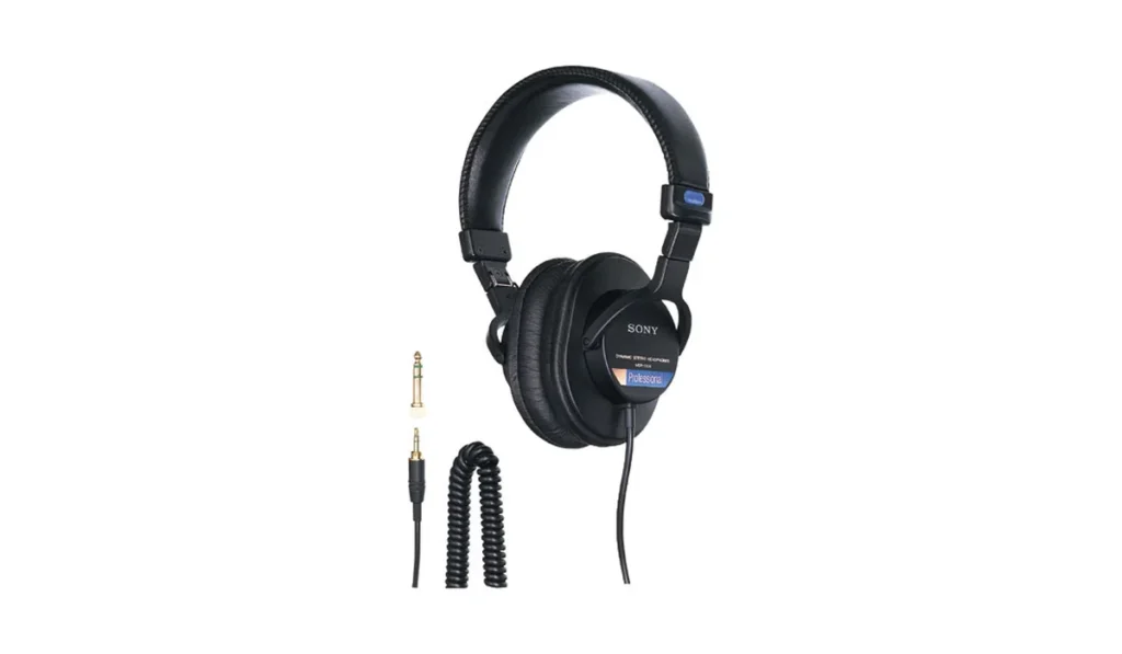 Sony MDR-7506 closed-back studio headphones with a coiled cable and plug adapter
