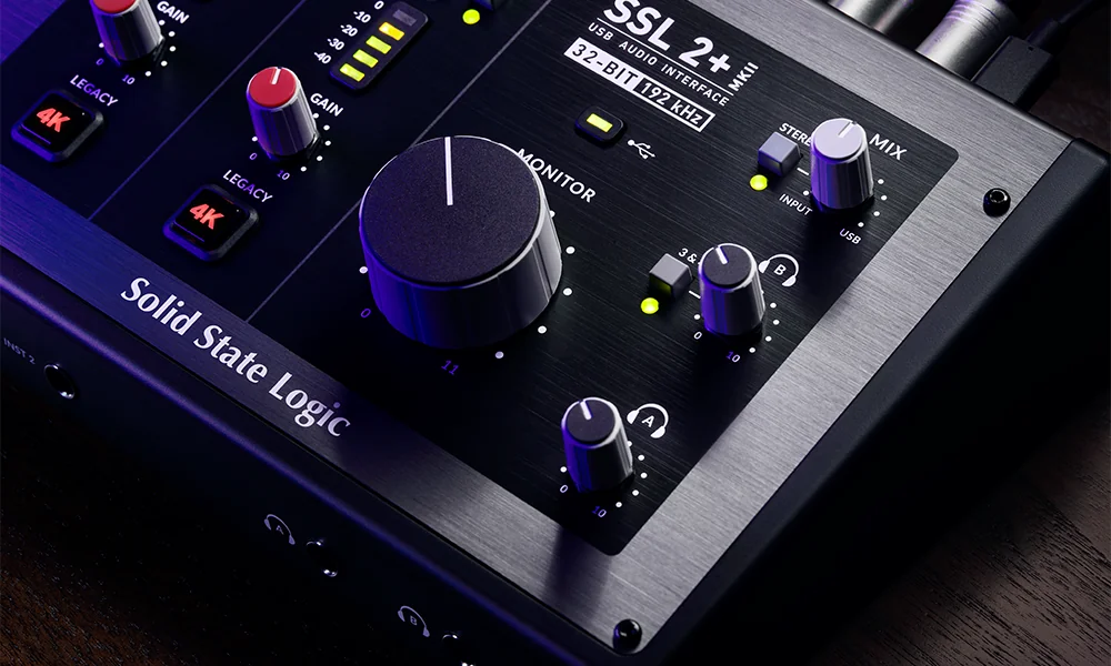 SSL 2+ MKII audio interface close-up with its red Legacy 4K buttons, level meters and large monitor knob