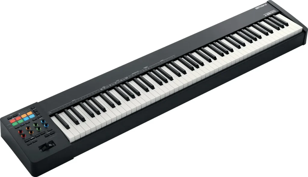 Roland A-88MKII 88-key hammer-action MIDI keyboard with 8 lit pads and 8 knobs, seen at an angle